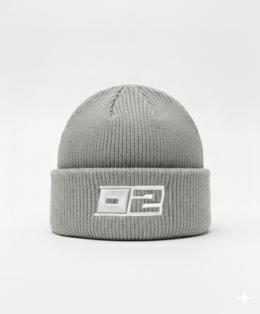 0-2 Brand™ Knit Beanie Light Graywith white 3D puff embroidered 0-2 badge on cuff, heavyweight rib knit for cold-weather wear.