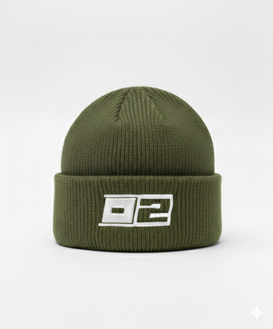 0-2 Brand™ Knit Beanie Olive Green with white 3D puff embroidered 0-2 badge on cuff, heavyweight rib knit for cold-weather wear.